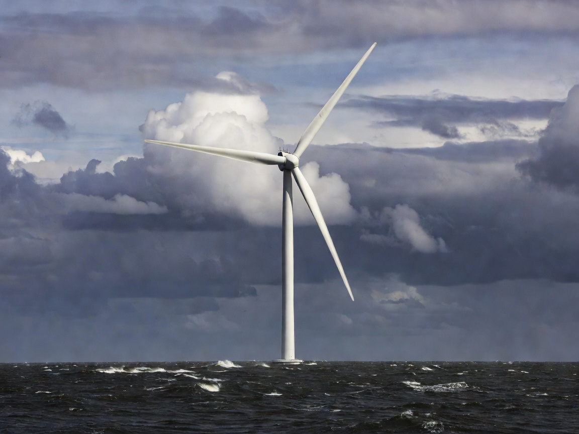 Offshore wind turbine against a cloudy horizon